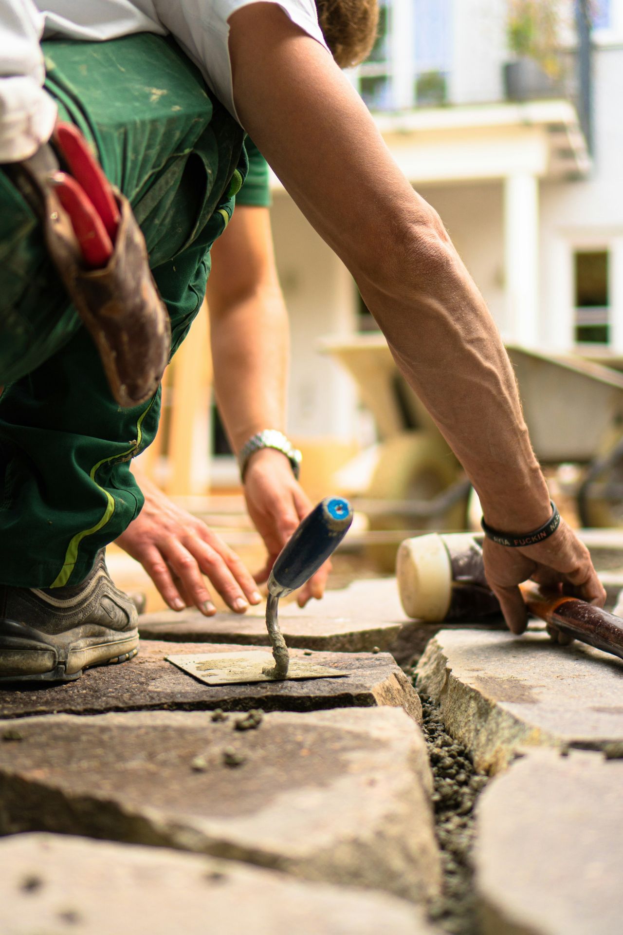 a man working on a piece of concrete